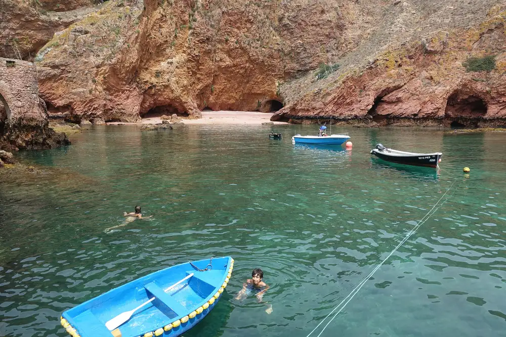 Boats in a clear-water cove on Berlenga island