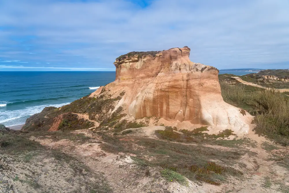 Red sandstone cliff on the coast near Peniche